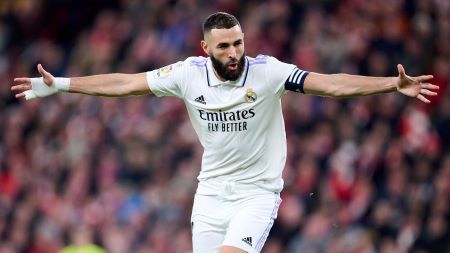 Karim Benzema with his arms spread wide celebrating a goal