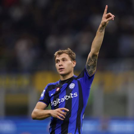Nicolo Barella celebrating a goal pointing at the sky